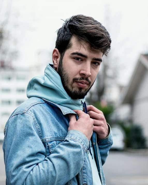 a close up of a person wearing a jacket, by Adam Dario Keel, wearing denim, zayn malik, lgbtq, confident looking