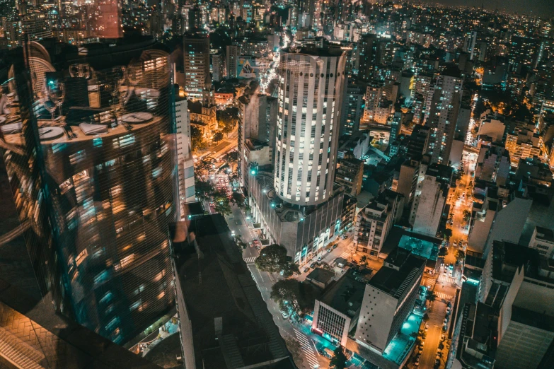 an aerial view of a city at night, pexels contest winner, são paulo, instagram story, night life buildings, stacked image