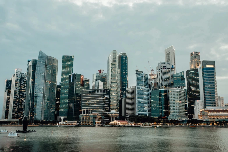 a large body of water with a bunch of tall buildings in the background, pexels contest winner, south east asian with long, unsplash 4k, concrete jungle, harbour