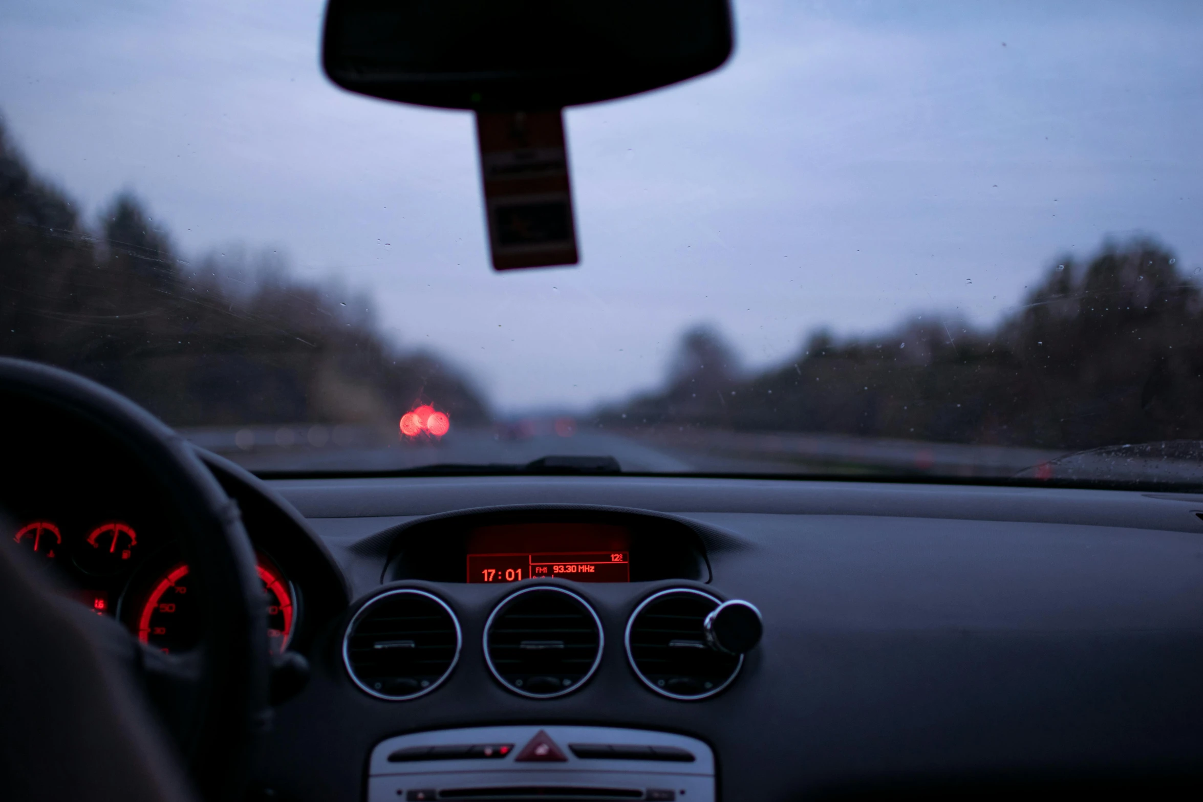 a close up of the dashboard of a car, unsplash, realism, evening at dusk, fan favorite, pov from rear, pov