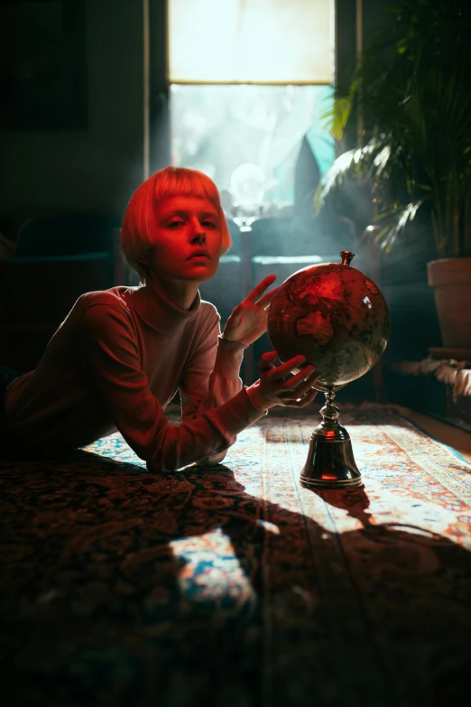 a woman sitting at a table with a globe in front of her, an album cover, inspired by Elsa Bleda, unsplash contest winner, magical realism, girl with short white hair, anaglyph lighting, portrait of max caulfield, tarot