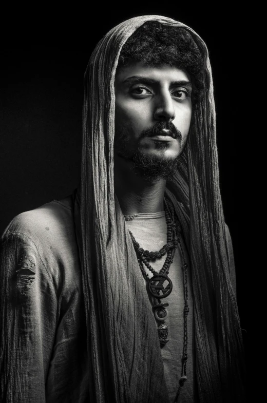 a black and white photo of a man with long hair, a character portrait, inspired by Mirabello Cavalori, jack sparrow, raden saleh, tim booth, long yellow hair