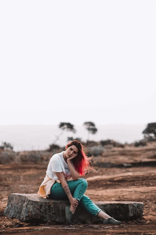 a woman sitting on top of a tree stump, trending on pexels, color field, red hair girl, view(full body + zoomed out), trending on artist, handsome girl