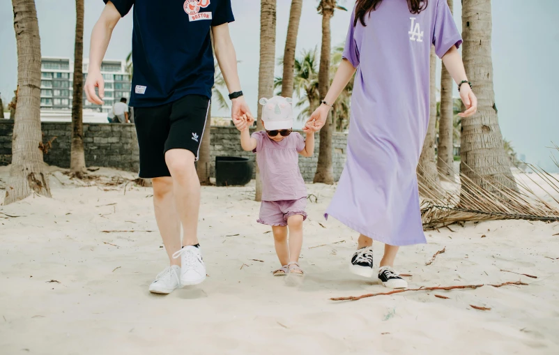 a man and woman walking down a beach holding hands, a cartoon, pexels contest winner, violet coloured t-shirt, with a kid, third trimester, in style of lam manh