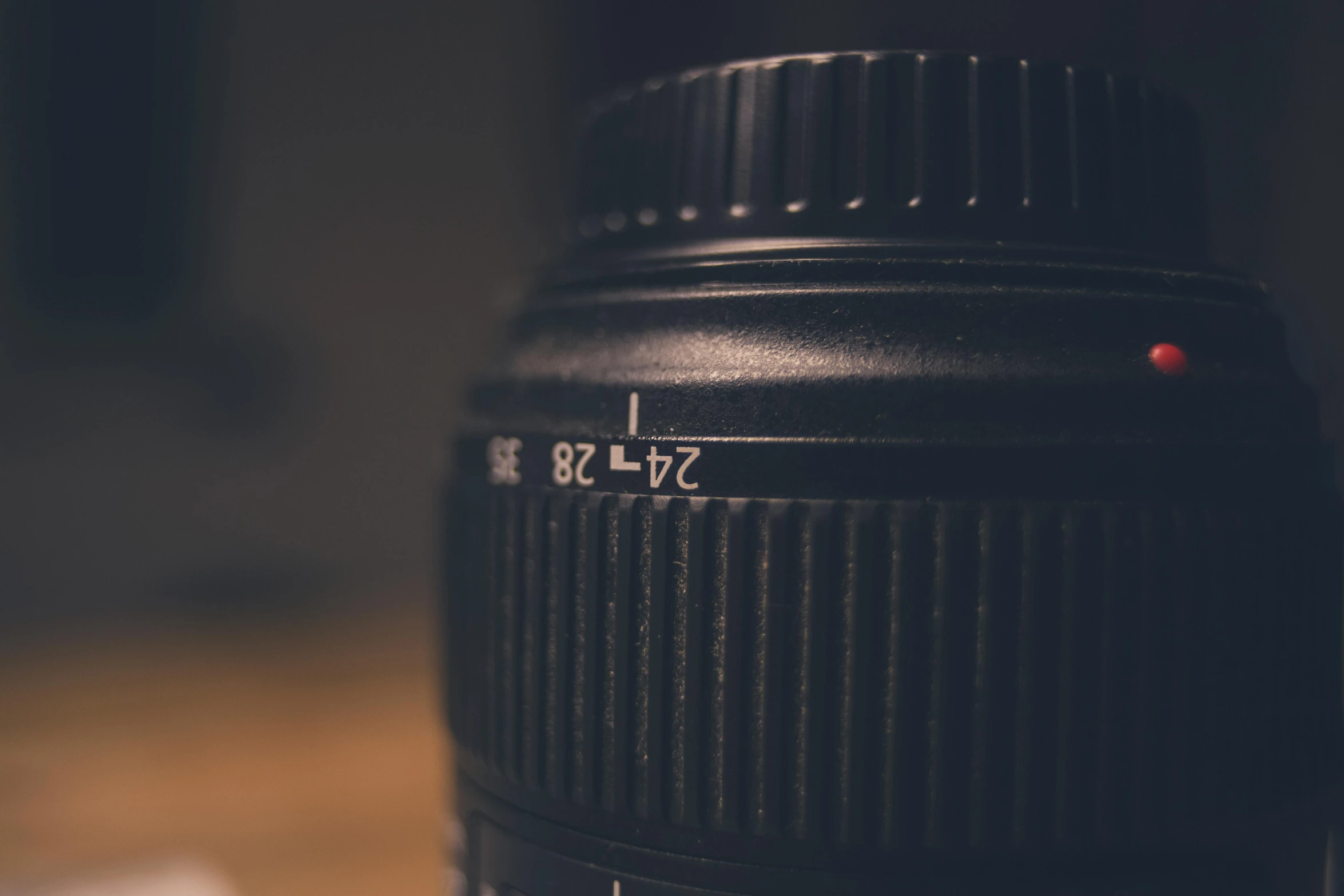 a close up of a camera lens on a table, a macro photograph, unsplash, 82 mm sigma, canon 8 0 d, 5 2 mm f 5. 6, small depth of field