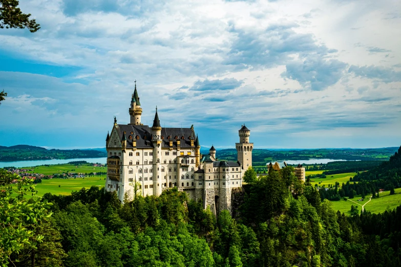 a castle sitting on top of a lush green hillside, munich, fan favorite, ivory towers, exterior