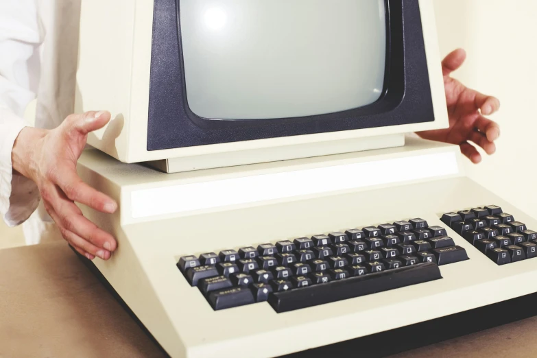 a close up of a person holding a computer, a computer rendering, by Everett Warner, unsplash, 70s photo, old retro museum exhibition, terminals, 15081959 21121991 01012000 4k