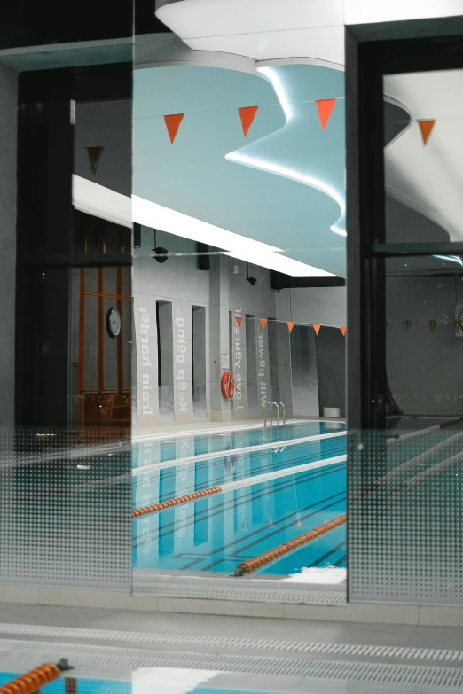 a view of a swimming pool through a window, an album cover, unsplash, conceptual art, grey orange, gym, college, aqua volumetric lights