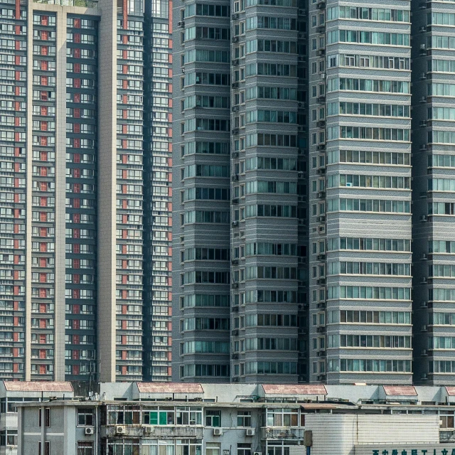 a group of tall buildings sitting next to each other, pexels contest winner, hyperrealism, hou china, ten flats, settlement, panels