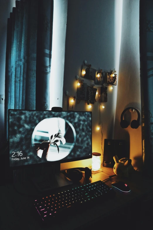 a computer monitor sitting on top of a wooden desk, a picture, inspired by Elsa Bleda, computer art, ✨🕌🌙, cozy lights, pc screen image, sweet night ambient