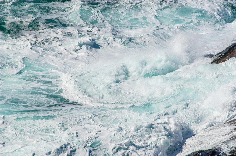 a man riding a wave on top of a surfboard, pexels, process art, sea foam, standing in a maelstrom, whirlpool, offshore winds