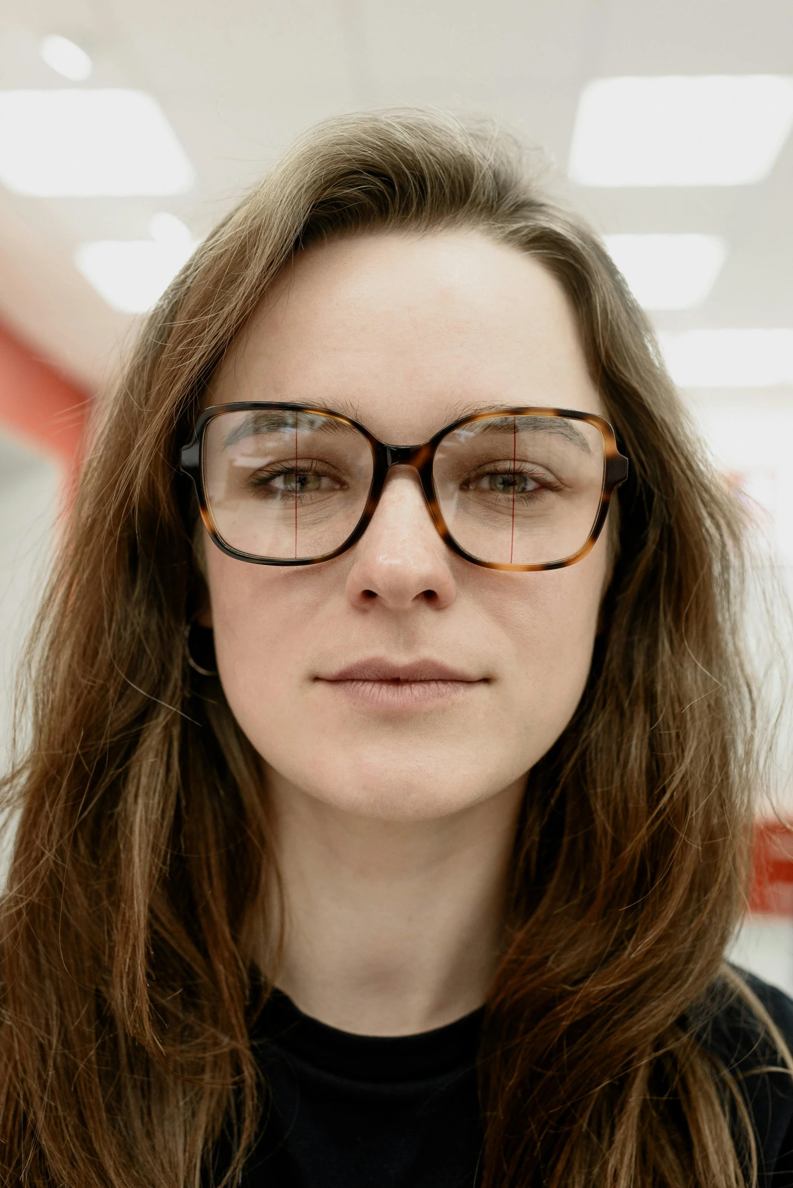 a close up of a person wearing glasses, a picture, dasha taran, with symmetrical facial features, student, 60mm portrait