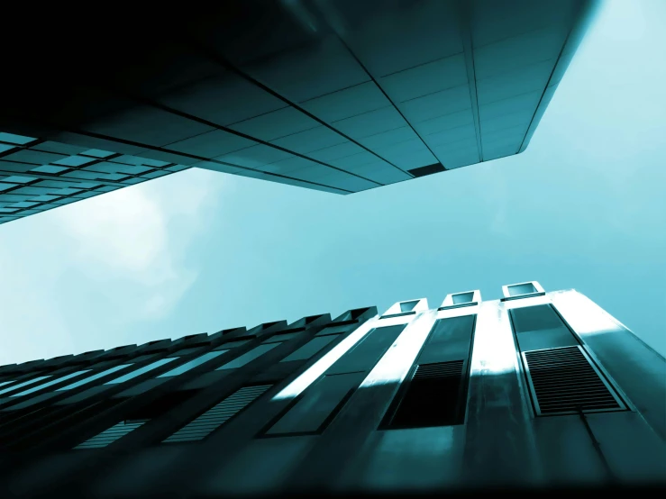 a tall building with a blue sky in the background, cyan, falling buildings, atmospheric photograph, rectangle