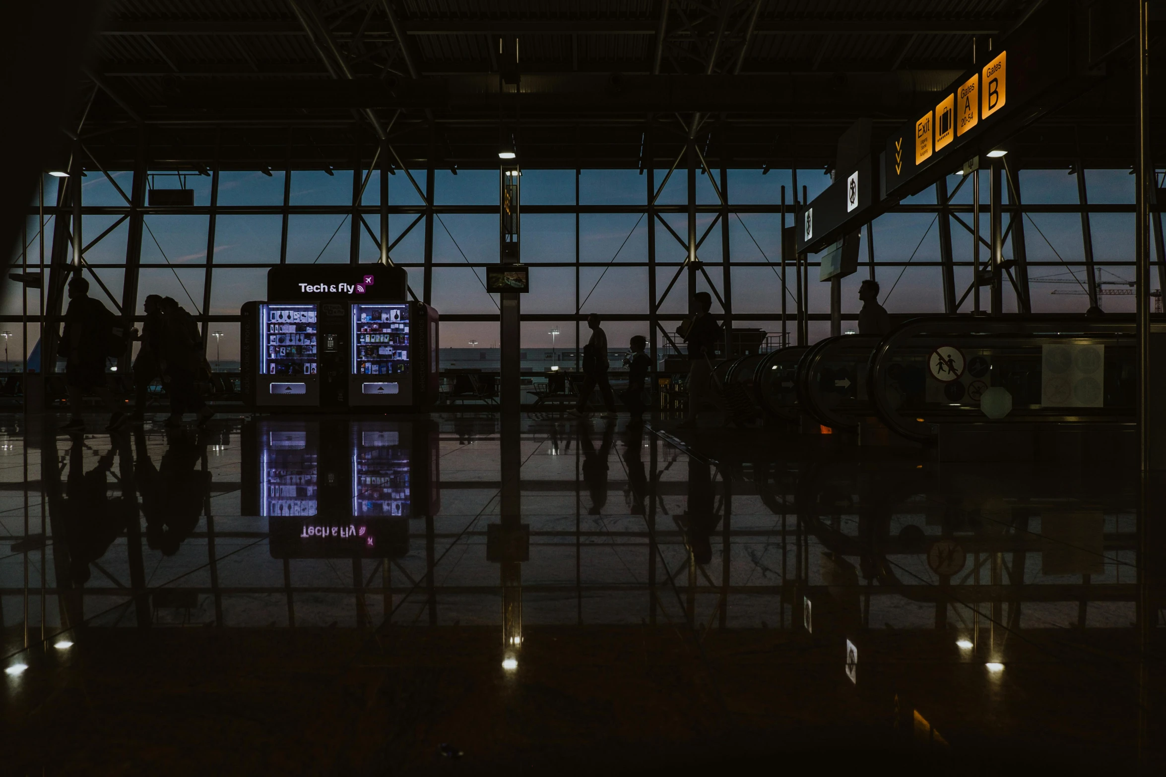 a couple of people that are standing in front of a window, by Tobias Stimmer, pexels contest winner, black. airports, twilight ; wide shot, reflective floor, terminal text