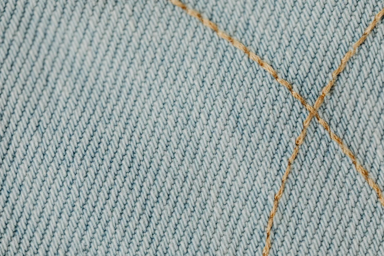 a pair of scissors sitting on top of a pair of jeans, a stipple, light grey blue and golden, seamless micro detail, seams stitched tightly, dezeen