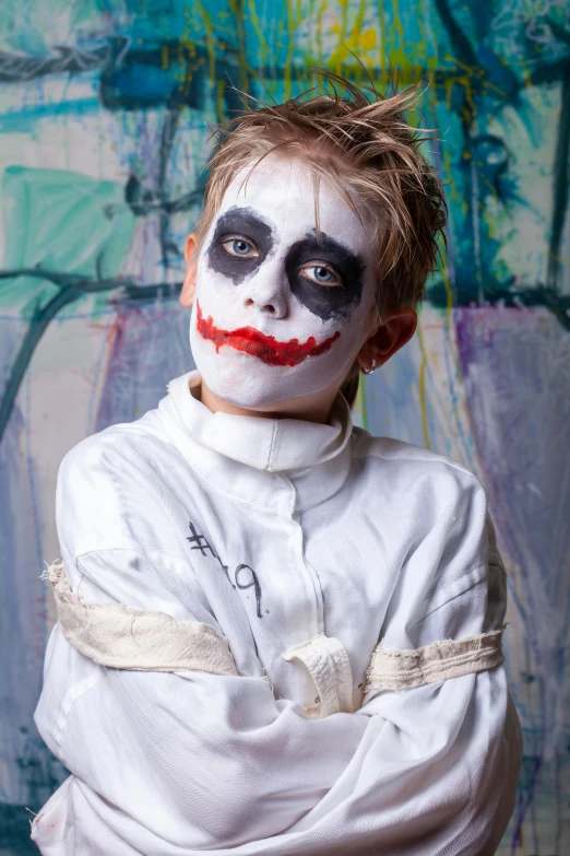 a young boy dressed as a clown posing for a picture, inspired by James Bolivar Manson, trending on reddit, graffiti, ( ( theatrical ) ), super hero, white facepaint, 2010s