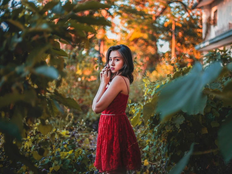 a woman in a red dress talking on a cell phone, inspired by Elsa Bleda, pexels contest winner, clothed in vines, indian girl with brown skin, hd wallpaper, asian girl