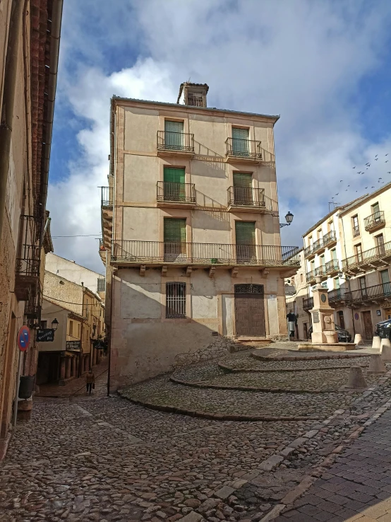 a person riding a skateboard down a cobblestone street, inspired by Serafino De Tivoli, pink marble building, 8 k image, staggered terraces, in muddy medieval village square