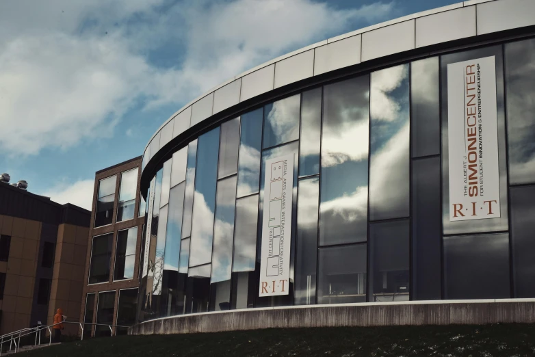 a close up of a building with a sky in the background, unsplash, academic art, sportspalast amphitheatre, next to a big window, grey, weta studios