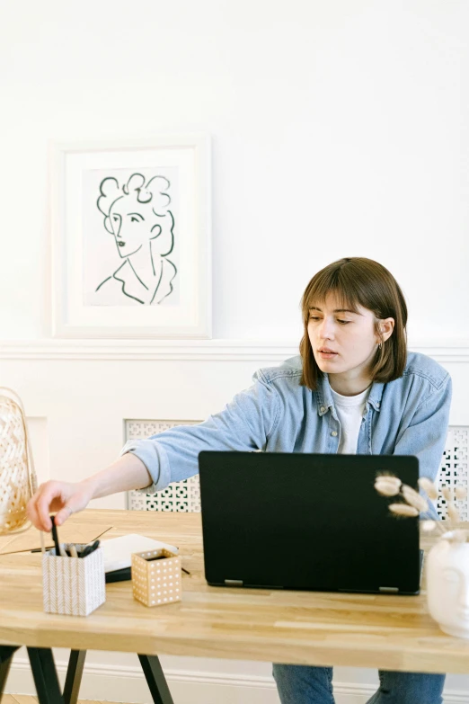 a woman sitting at a table with a laptop, trending on pexels, arbeitsrat für kunst, ilustration, low quality photo, office clothes, art decos