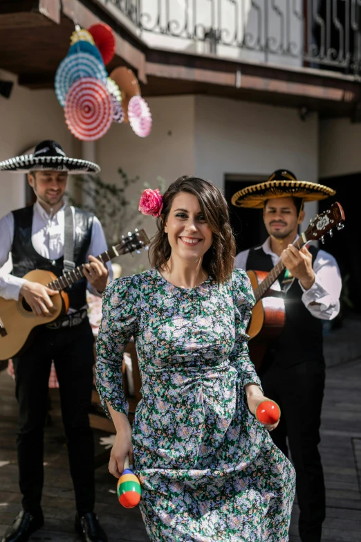 a group of people that are standing in the street, an album cover, inspired by Eva Gonzalès, pexels contest winner, happening, folklorico, 3 actors on stage, standing in a cantina, a still of a happy