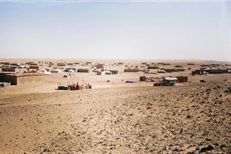 a small town in the middle of a desert, an album cover, by Nathalie Rattner, unsplash, les nabis, tents, photo from the dig site, 2000s photo, the panorama