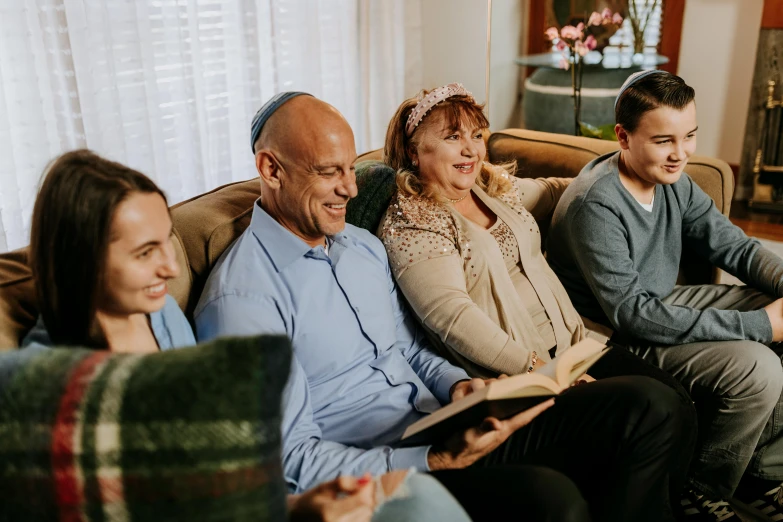 a group of people sitting on top of a couch, old testament, temuera morrison, profile image, parents watching