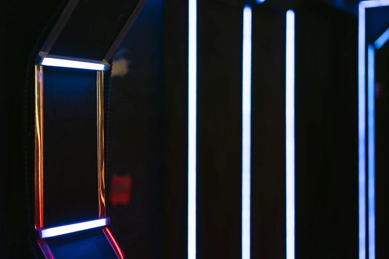a row of neon lights in a dark room, a hologram, pexels contest winner, light and space, red and blue back light, blue lightsaber, light frame, modern details
