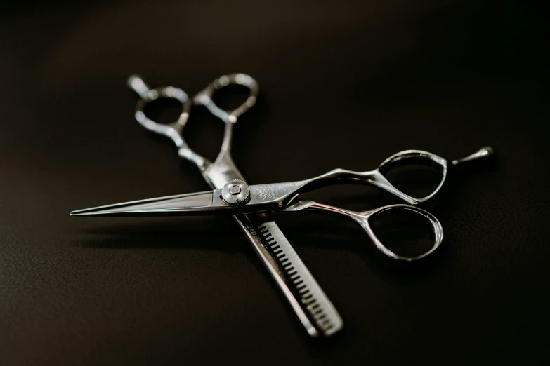 a pair of scissors sitting on top of a table, hair detailing, shot with sony alpha 1 camera, ((sharp focus)), thumbnail