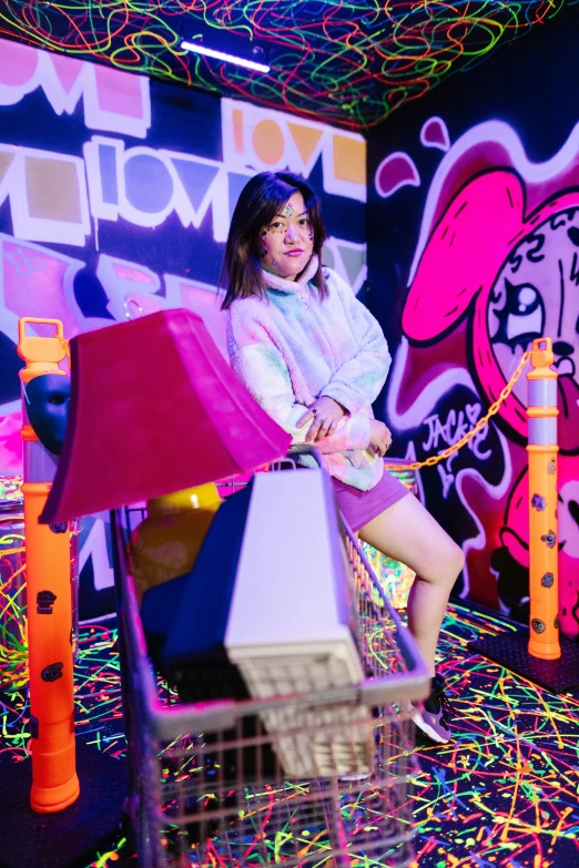 a woman sitting on top of a chair in a room, neon graffiti, kawaii vibe, softplay, leslie zhang