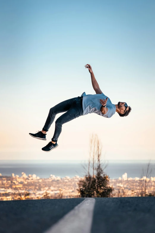 a man flying through the air while riding a skateboard, pexels contest winner, happening, parkour, avatar image, high above the ground, positing on rock super hero pose