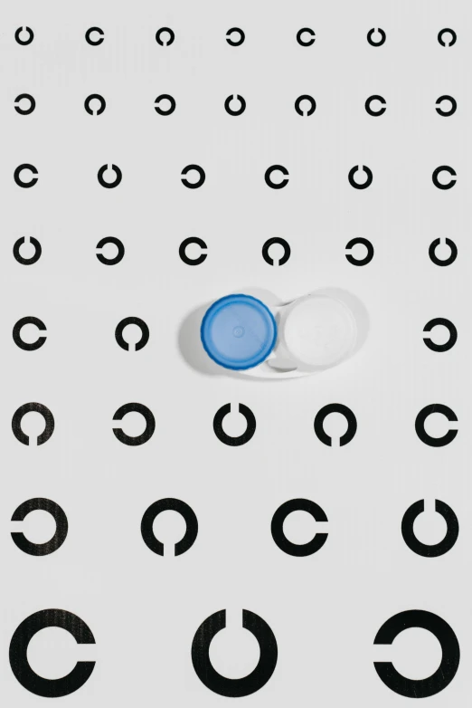 a pill sitting on top of a table covered in circles, an album cover, by Jang Seung-eop, reddit, clear blue eyes, icon pattern, contrast icon, ffffound