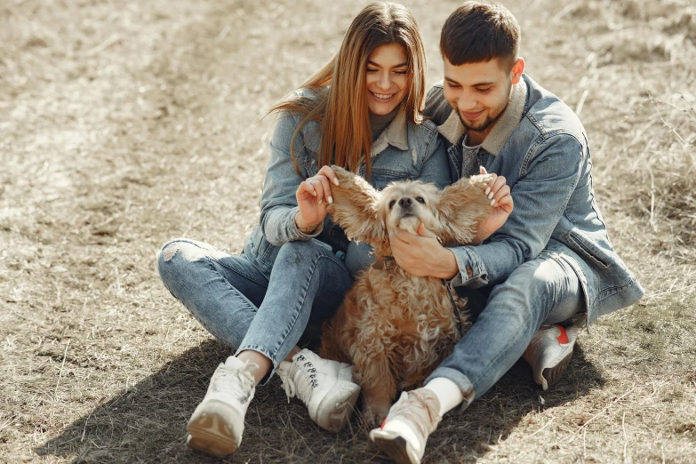 a man and woman sitting on the ground with a dog, pexels contest winner, 15081959 21121991 01012000 4k, fertility, playful pose, brown