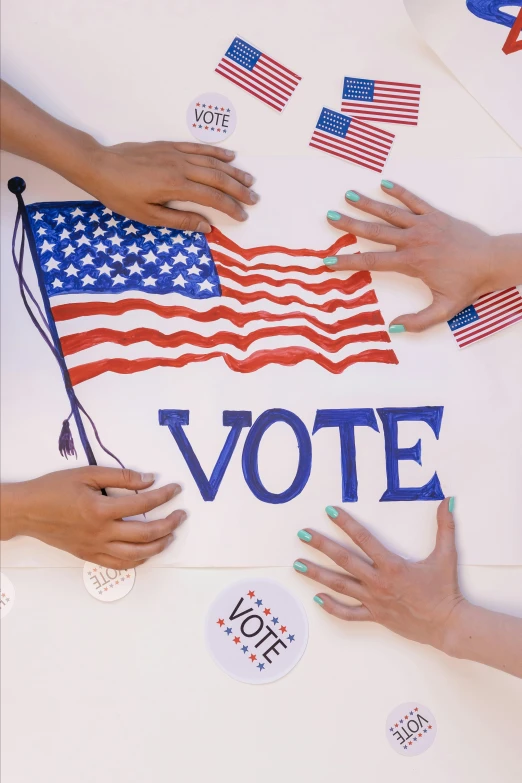 a group of people holding american flags on top of a table, a digital rendering, by Harriet Zeitlin, shutterstock, renaissance, election poster, holding hands, 🚿🗝📝, high angle close up shot