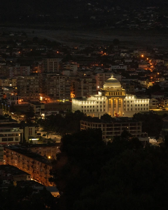 a view of a city at night from the top of a hill, pexels contest winner, quito school, stalinist architecture, profile image, miniature city, citadel of erbil