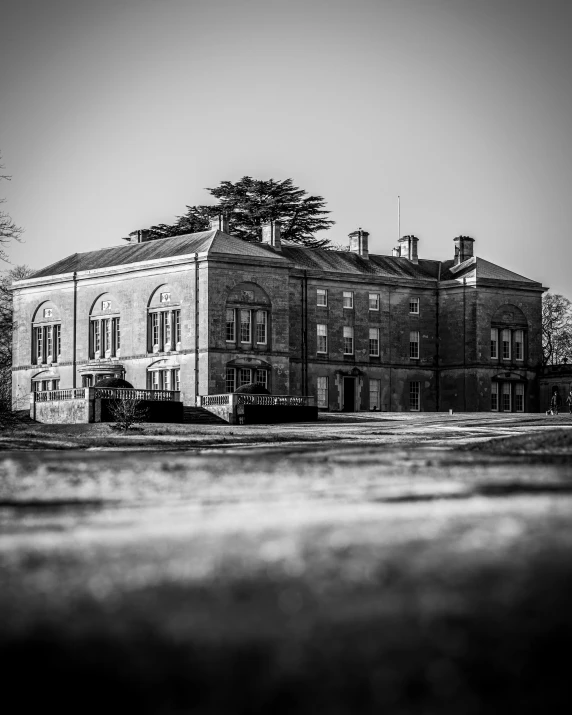 a black and white photo of a large building, beautiful surroundings, photoshoot, conor walton, detailed medium format photo