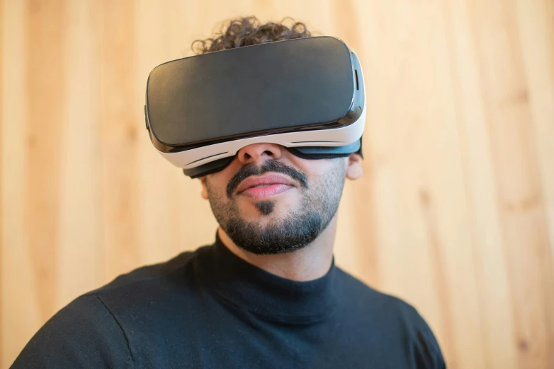 a man wearing a virtual reality headset in front of a wooden wall, shutterstock, hypermodernism, afro tech, portrait photo, avatar image