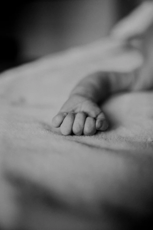 a black and white photo of a baby's feet, by Felix-Kelly