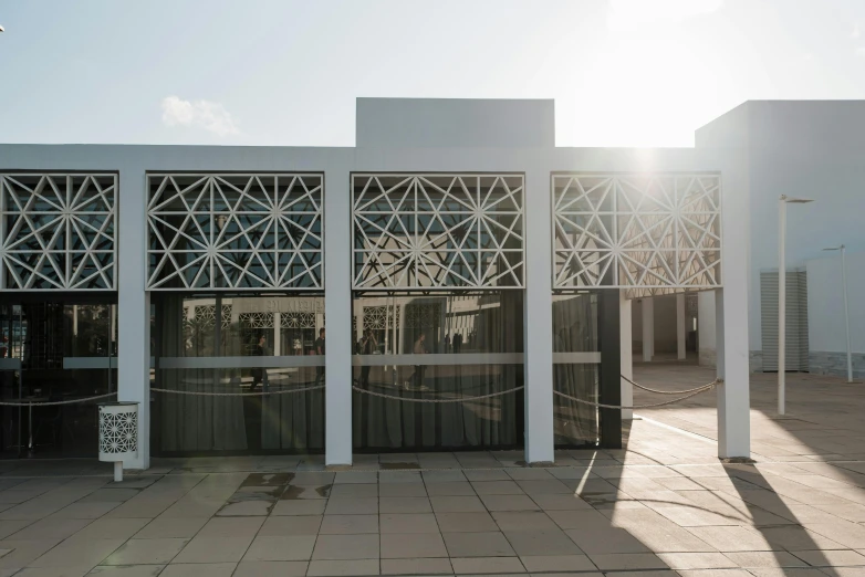 a red fire hydrant sitting in front of a building, a digital rendering, by Alejandro Obregón, unsplash, berlin secession, mies van der rohe, circular gate in a white wall, pentagon, brazil