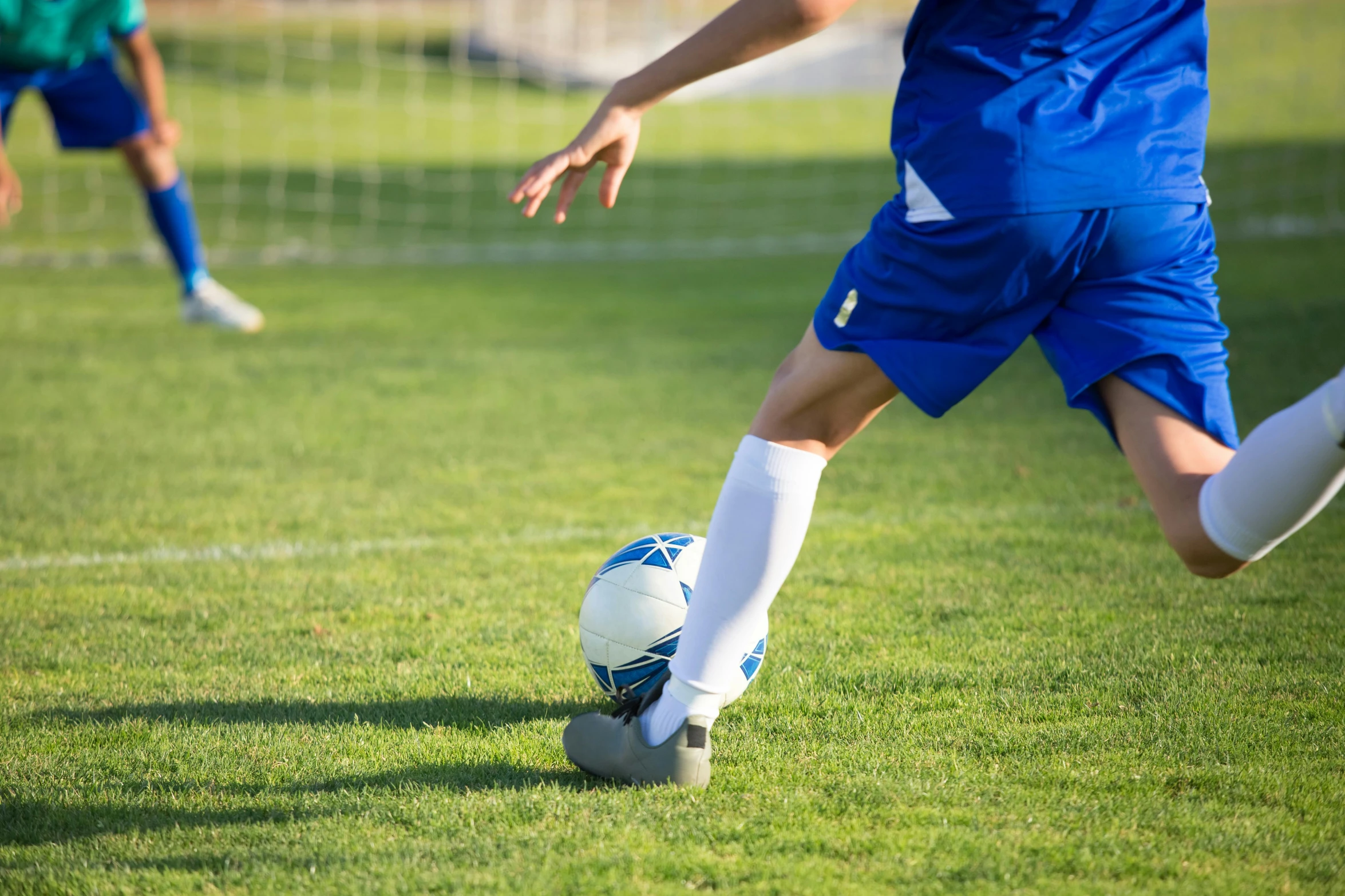 a person kicking a soccer ball on a field, profile image, fan favorite, sports clothing, rectangle
