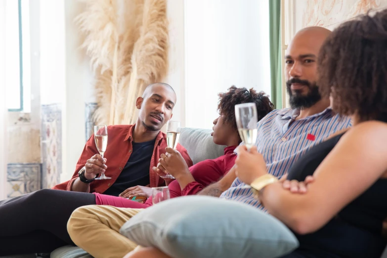 a group of people sitting on a couch drinking wine, pexels contest winner, figuration libre, lgbtq, airbnb, profile image, champagne