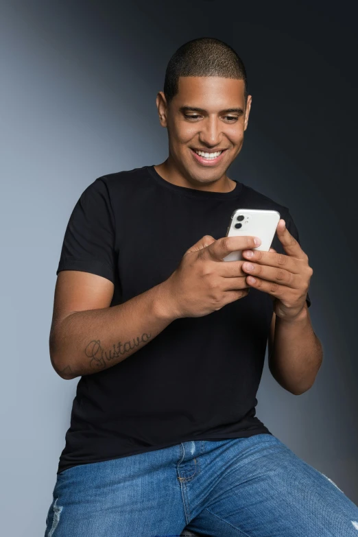 a man sitting on a stool looking at his cell phone, trending on pexels, renaissance, a handsome man，black short hair, ronaldo nazario, dating app icon, smiling male