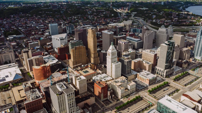 a large city with lots of tall buildings, a colorized photo, by Dan Frazier, unsplash contest winner, buffalo, aerial, pittsburg, slide show