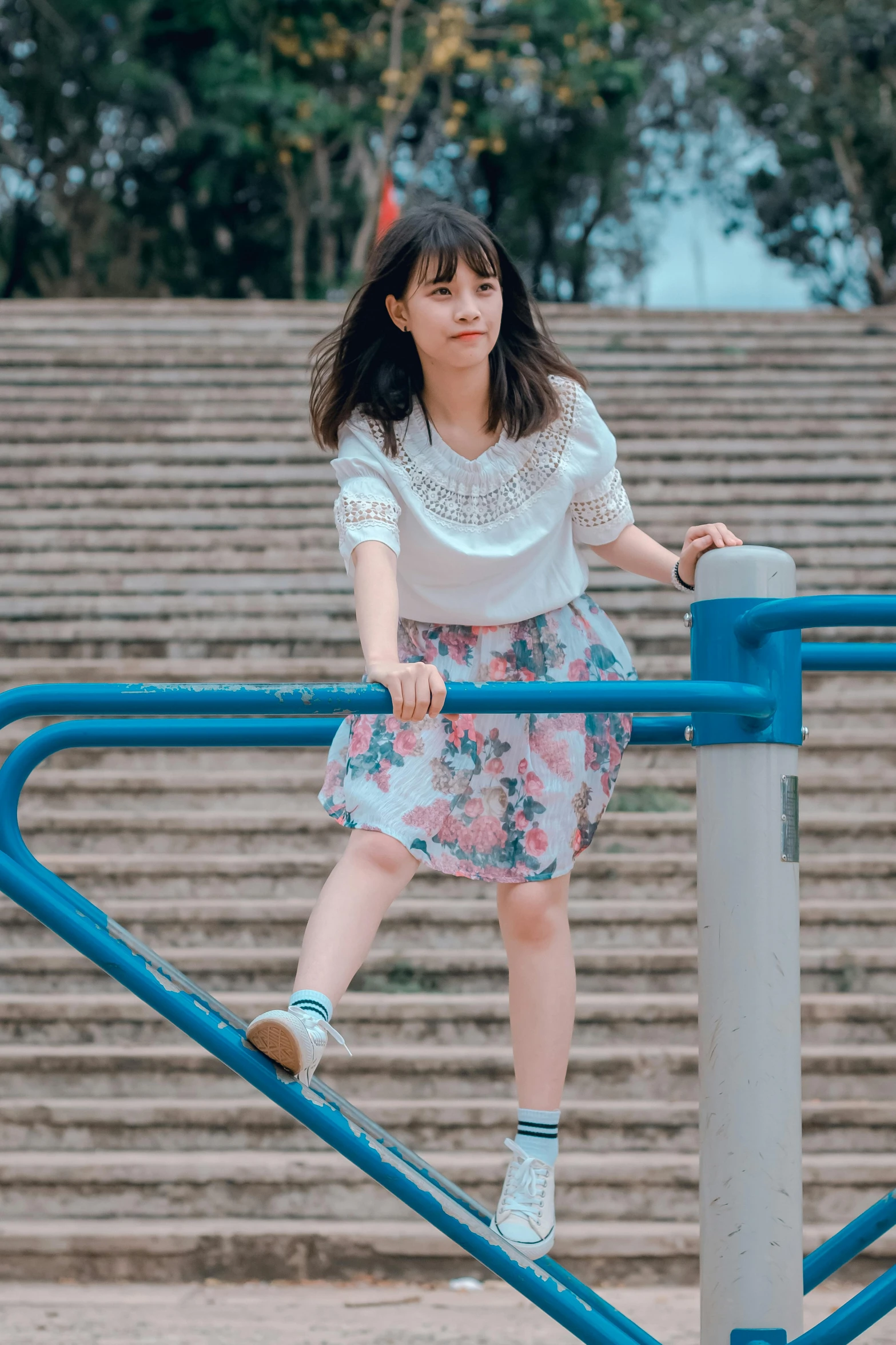 a woman standing at the top of a set of stairs, inspired by Kim Jeong-hui, pexels contest winner, cute young girl, playground, dressed in a top and shorts, 15081959 21121991 01012000 4k