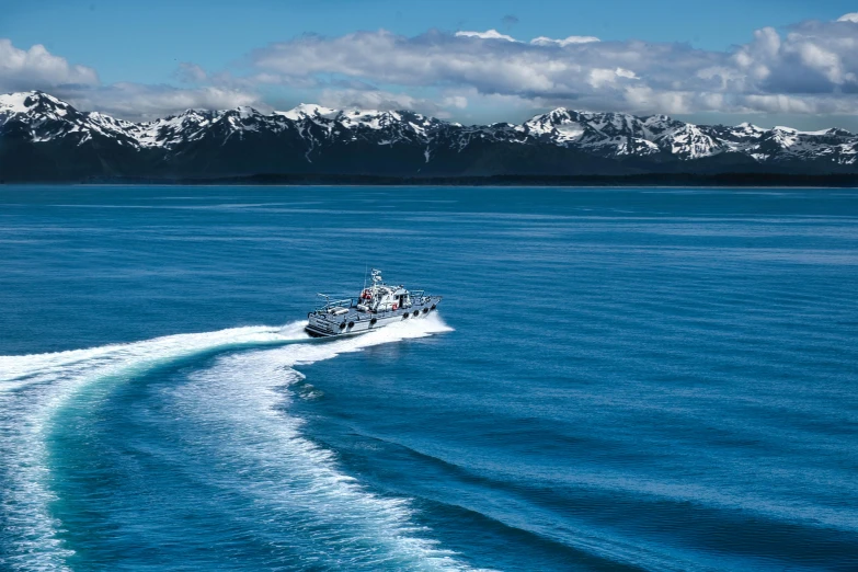 a boat on a body of water with mountains in the background, ocean spray, thumbnail, glaciers, crossing the blue horizon