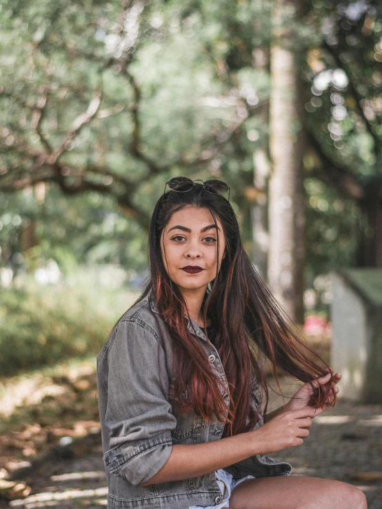 a woman sitting on the ground with a brush in her hand, pexels contest winner, sumatraism, headshot profile picture, 🤤 girl portrait, at the park, in sao paulo