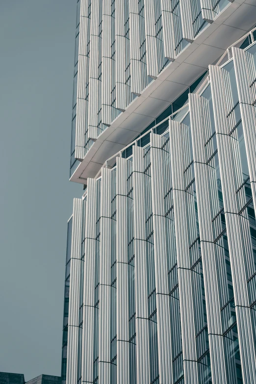 a plane flying in front of a tall building, unsplash contest winner, modernism, lots of glass details, white and pale blue toned, very elongated lines, thin face structure