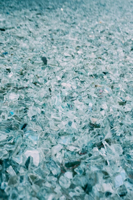 a pile of broken glass on the ground, by Elsa Bleda, unsplash, visual art, soft blue texture, crowds, 2 0 0 0 s, made of glass