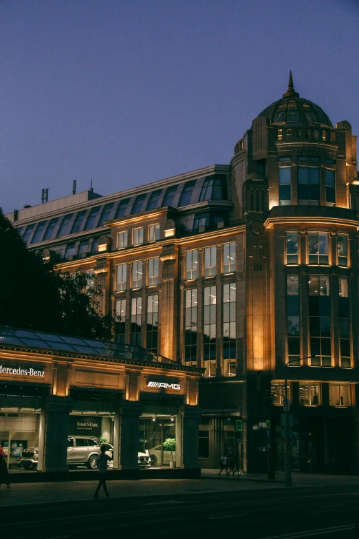 a building that is lit up at night, inspired by Albert Paris Gütersloh, shops, at dawn, london, medium shot angle