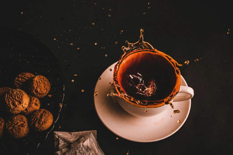 a cup of tea sitting on top of a saucer, pexels contest winner, process art, splashing, chocolate, thumbnail, dark